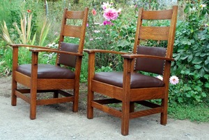 Pair of Stickley Brothers bow-arm chairs.